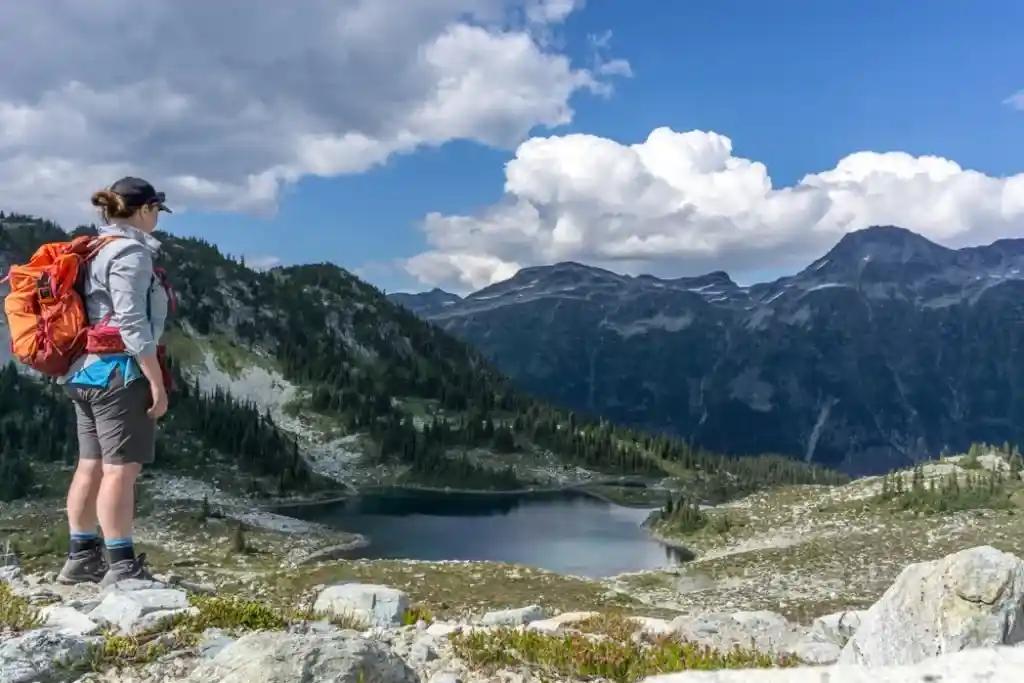 A hiker stands above the Adit Lakes near Russet Lake in Whistler