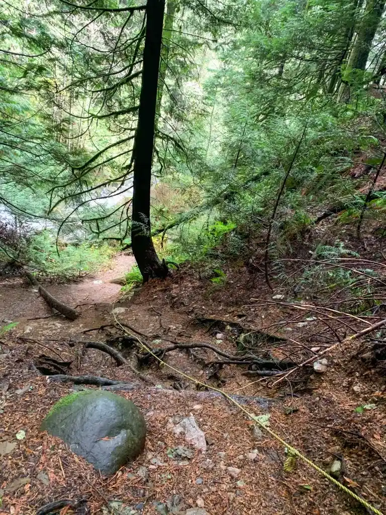 A sketchy hand line leads down a steep and loose slope to the base of Langdale Falls