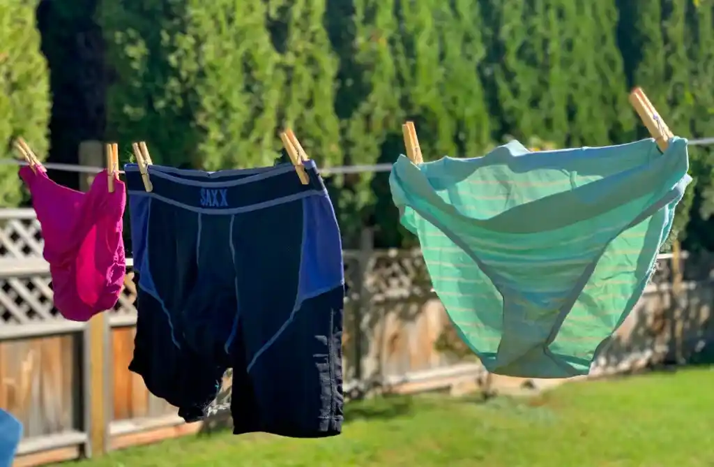 hiking underwear for women and men hanging on a clothesline