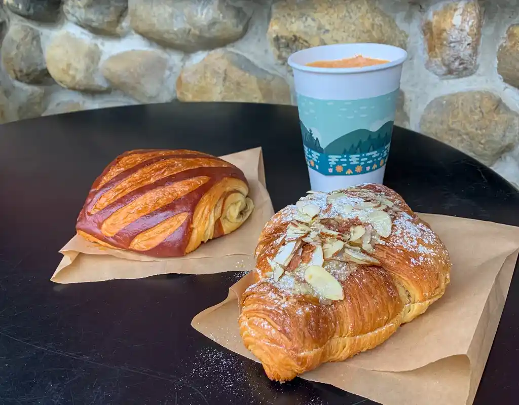 Croissants and coffee on an outdoor table at Ratio Coffee in Vernon, BC.