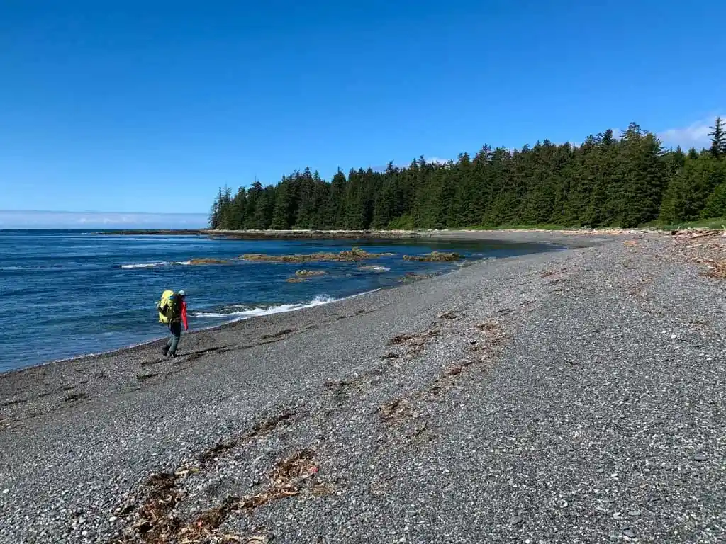 Hiking a gravel beach on the Tatchu Peninsula