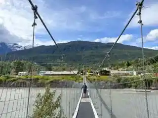 A man walks across the old suspension bridge in the village of Gitwinksihlkw in the Nass Valley