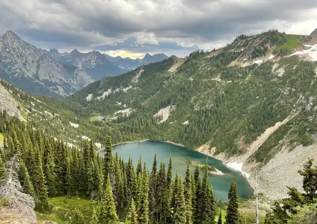 An alpine lake nestled between mountains in North Cascades National Park.