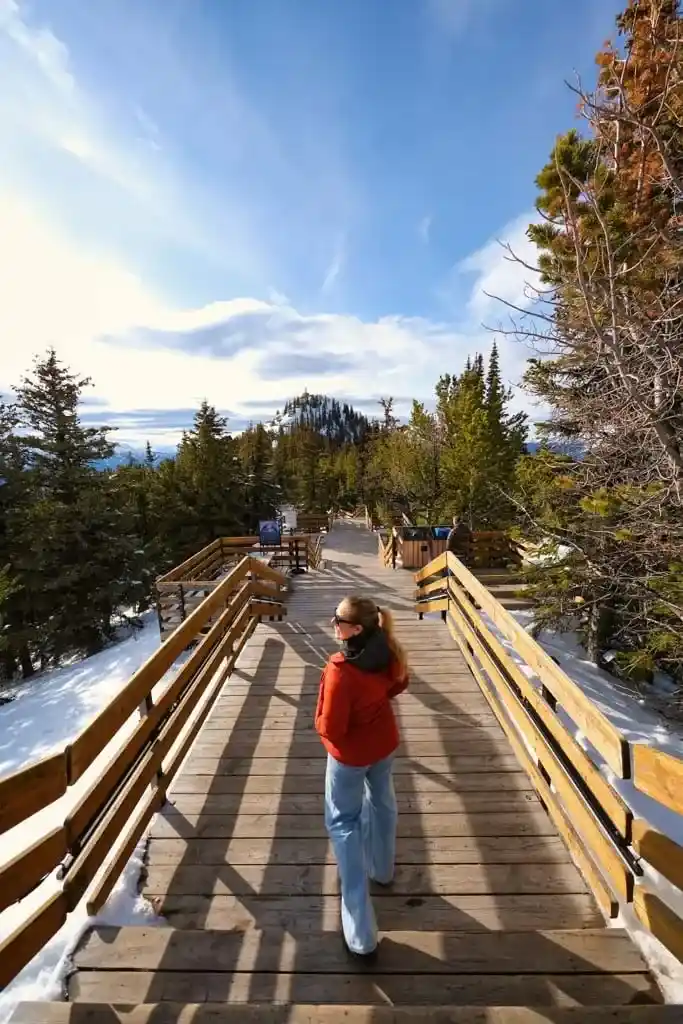 A woman walks on the boardwalk at the Banff Golda in April. Photo: Natasha Alden/The Banff Blog