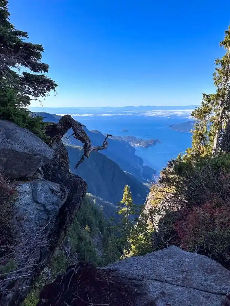 View from a cleft in the rocks down to Howe Sound and the Sea to Sky Highway from St. Mark's Summit