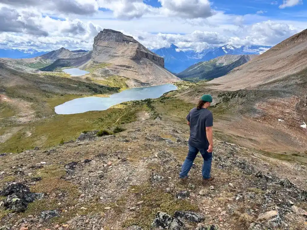 A hiker descends Packer's Pass Peak.