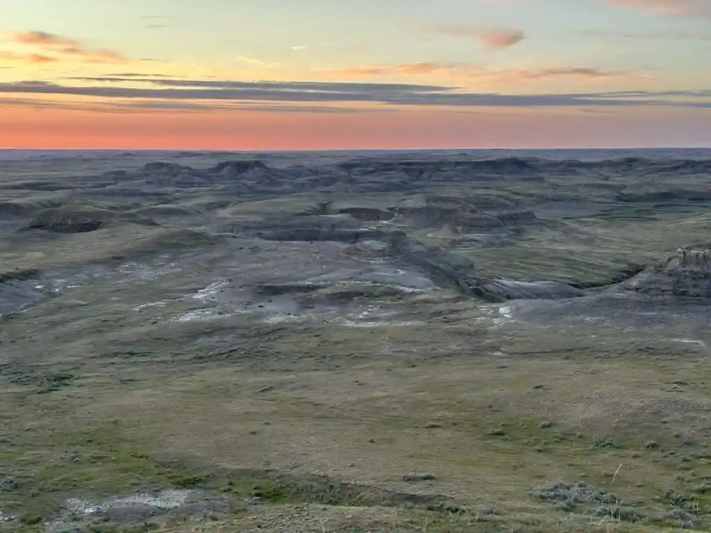 View of the badlands in Grasslands National Park at sunset